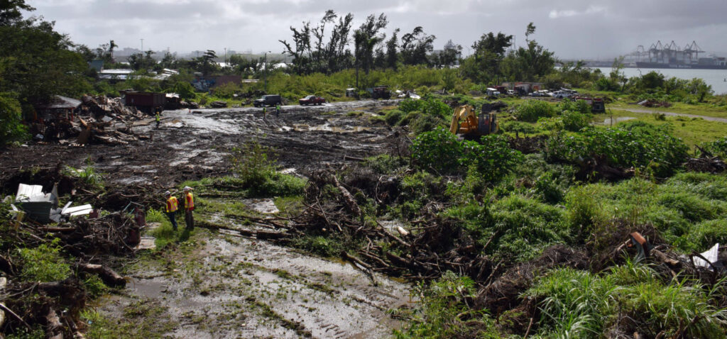 Photo of debris from Hurricane Maria in Puerto Rico and clean up team